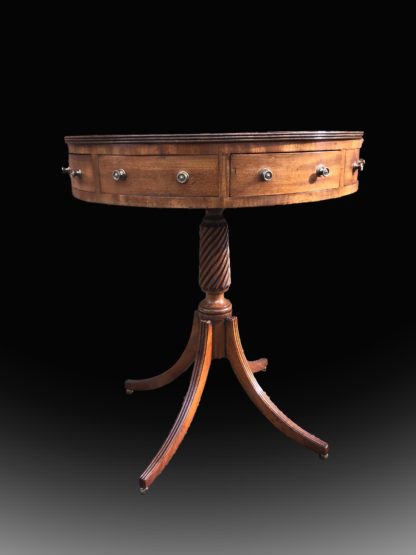Outstanding George III mahogany drum table angle front