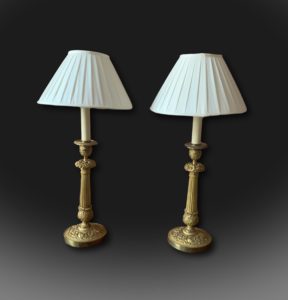 A pair of early 19th century French candlesticks lamps