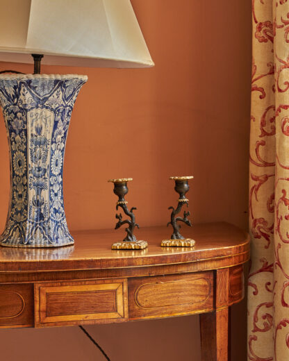 side table with lamp and candlesticks