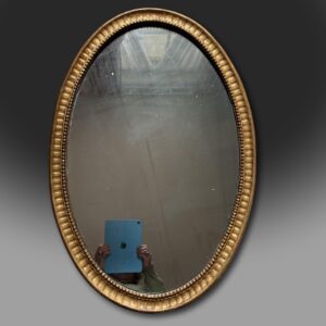 George III late 18th century oval giltwood mirror